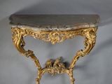 an antique console table with a marble top on a white background