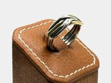 a wooden box with a ring on top of it