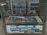 a metal cart with a bunch of books on it