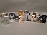many different types of perfumes on a white surface