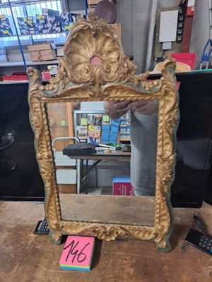 a man that is standing in front of a mirror