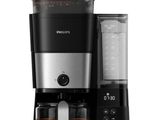 a black and silver coffee maker sitting on top of a counter