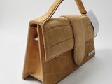 an image of a handbag made out of sued