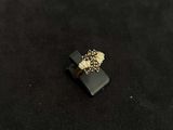 a ring that is sitting on top of a black surface