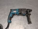 a drill that is sitting on a metal surface