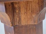 a close up of a wooden table with a clock on it