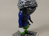 a small figurine of a person on a skateboard