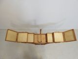 a small wooden airplane that is hanging from the ceiling