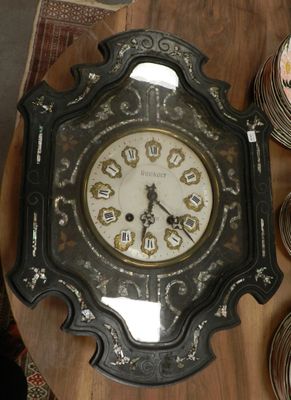 a clock that is on a table with plates on it