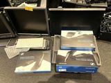 a lot of computer equipment that are sitting on the floor