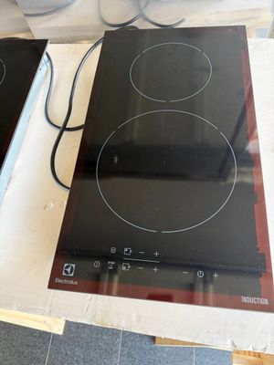 two electric burners on the counter top of the stove
