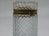 an image of a glass jar with a gold lid on a white surface