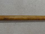 a baseball bat that is laying on the floor