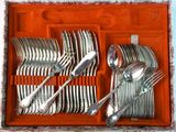 silverware in a red case with spoons, forks, and spoons