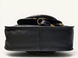 an image of a black purse with a gold buckle