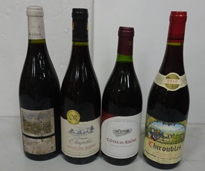 several bottles of wine are lined up on a table