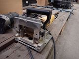 a machine that is sitting on a wooden bench