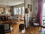 an image of a living room with a lot of furniture