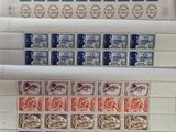 several different types of stamps are on top of a piece of paper