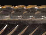 a clear glass container with a pattern on it