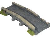 a small bridge that is made out of concrete