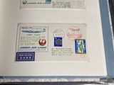 a book with stamps on it sitting on a table