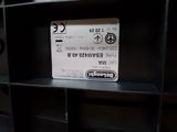 a picture of a sign on a shelf in a room
