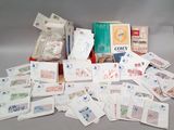 a pile of cards and envelopes with stamps on them