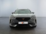 the front view of a grey car in a white room