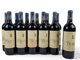 six bottles of red wine are lined up in a row