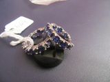 a ring that is sitting on a table with a tag
