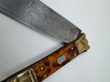 a knife that is laying on top of a table