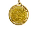 a gold coin with a bird on it on a white background