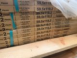 a stack of boxes of wood sitting on a pallet