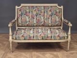 an image of a couch with a colorful patterned upholstered seat