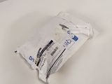 a bag of toilet paper sitting on a white table