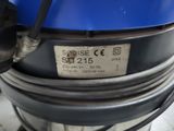 a close up of a blue machine with a label on it