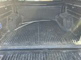 the back end of a truck with a flat bed and a flat bed in the back of it