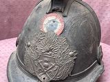 a helmet that is sitting on a pink surface