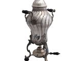 a silver urn on a stand on a white background