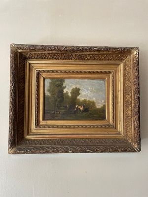 un vieux tableau accroché au mur d'une pièce