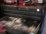 a drawer with a bunch of items on top of it