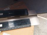a flat screen tv sitting on top of a cardboard box