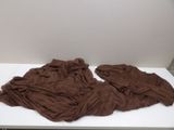 a brown cloth on a white table in a room