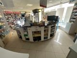 an image of a pharmacy shop with a wide angle view of the counter
