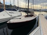 a boat that is docked in the water at the dock