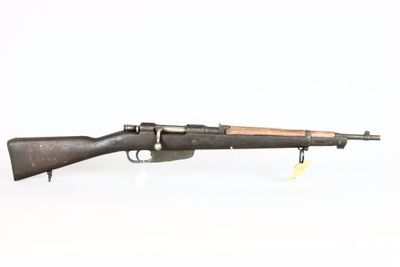 an old rifle with a wooden barrel on a white background