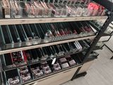 a lot of makeup products on display in a store