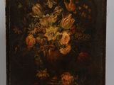 painting of flowers in a vase on an easel with a wooden stand