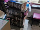 a stack of boxes sitting on a table in a room